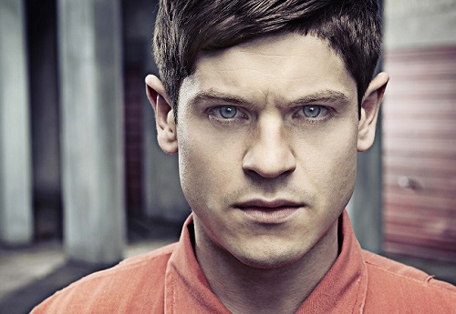 Actor Iwan Rheon in an organe outfit 