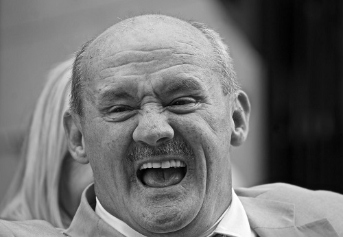 Brendan O’Carroll laughing happily with his mouth wide open